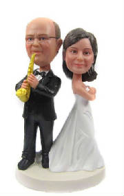 Wedding cake topper with sax-playing groom.jpg