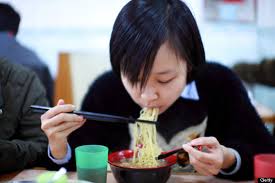 Chinese woman eating noodle soup.jpg