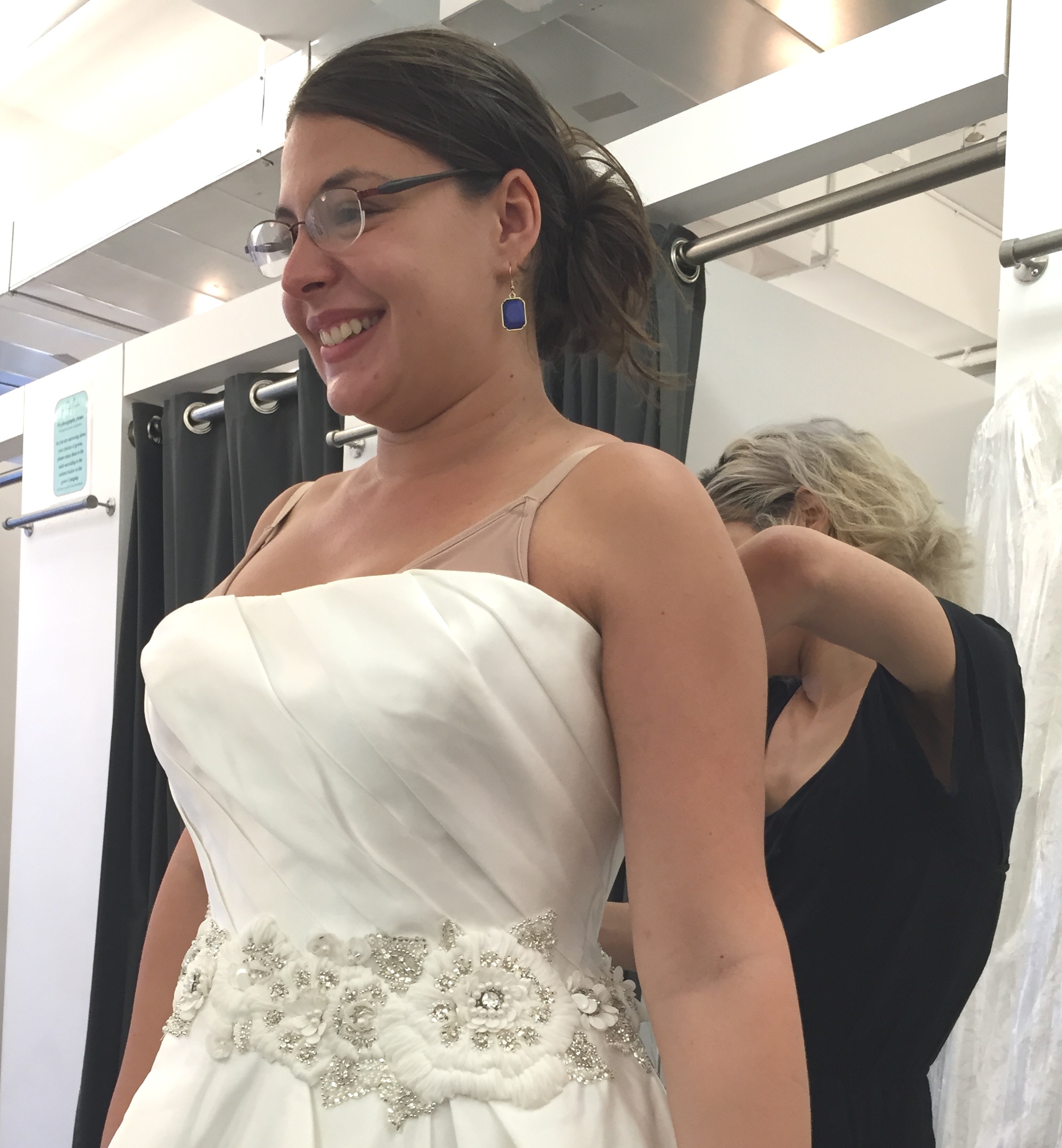 Kaitlin being zipped by Ashley in another bridal gown.JPG