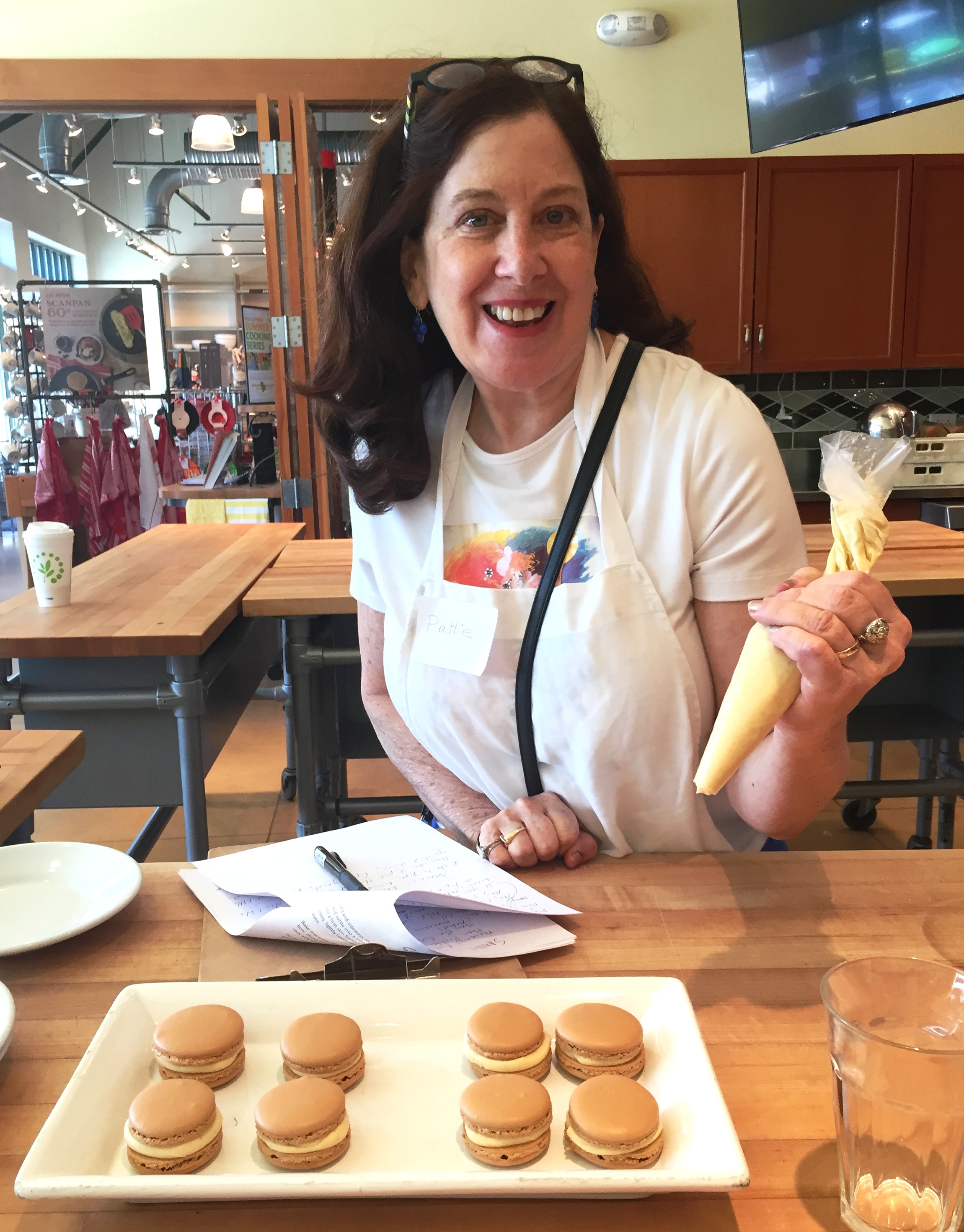 Pattie piping the macarons.JPG